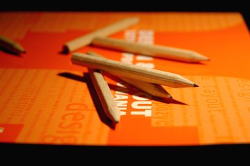 pencils-on-book-s-cover-orange-1198799 pencils-on-book-s-cover-orange-1198799